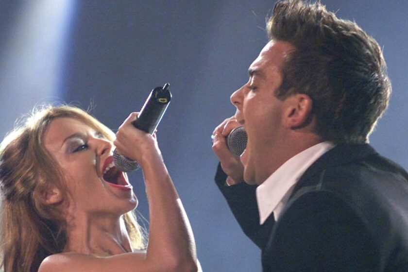 Robbie Williams şi Kylie Minogue, din nou în duet, după 16 ani