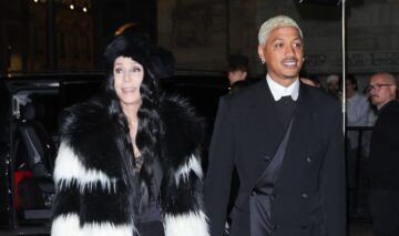 Cher și Alexander Edwards îmbrăcați elegant la evenimentul Dolce & Gabbana din Milano
